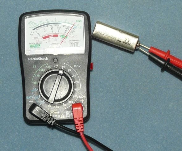9VBatteryWithMeter Here Are the Differences Between Voltage, Current, and Electric Field
