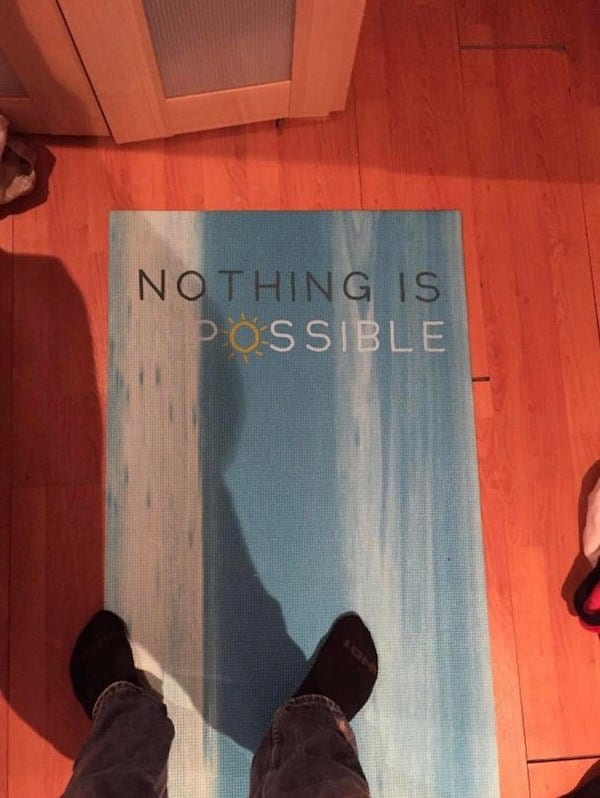 Sign is meant to say 'Nothing is impossible' but the 'im' is written in white on a white background, so it appears to say 'Nothing is possible.'