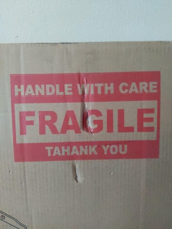 Damaged package reads: Handle with care. Fragile. Tahank you. 